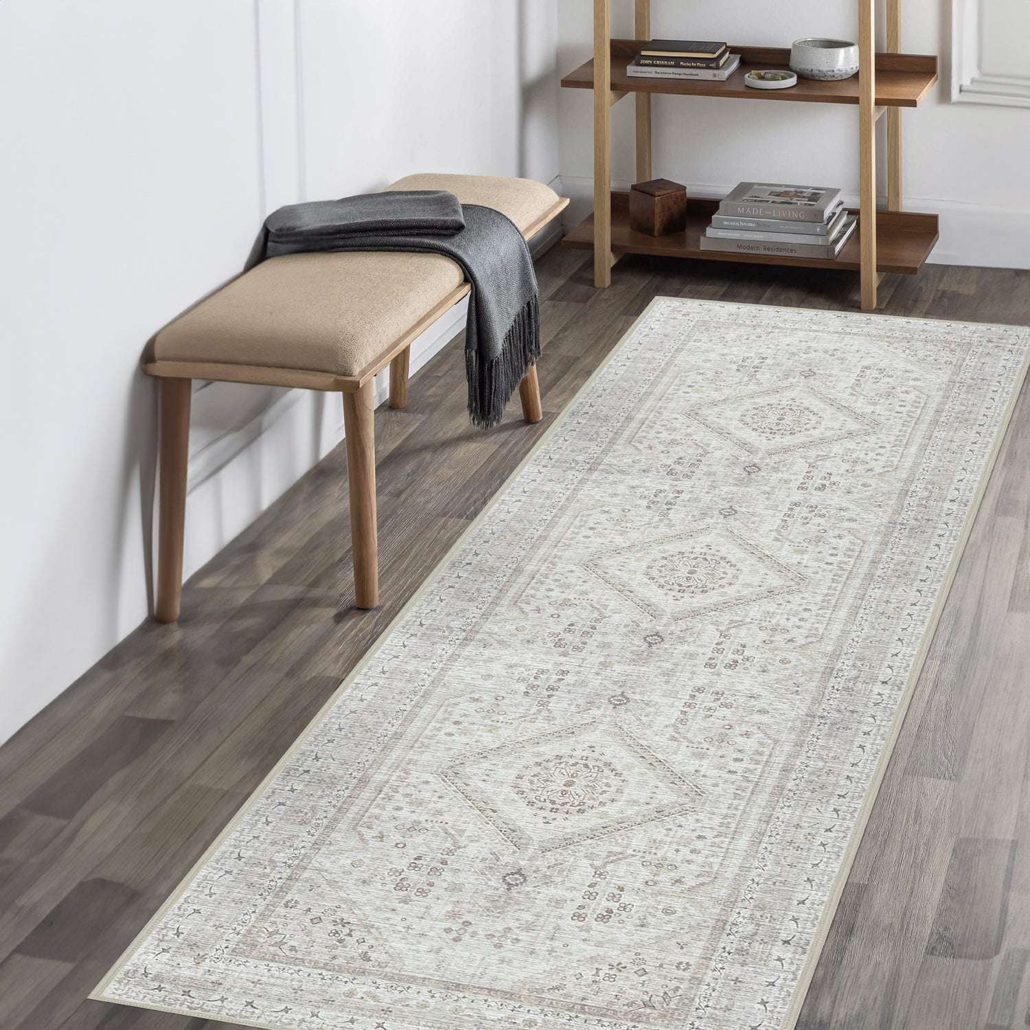 Entryway styled with the Vernal Senglea Beige, Taupe & Cream Machine Washable Runner, laid over dark wood flooring beside a cushioned bench and wooden shelving unit, creating a soft, elegant, and functional space.

