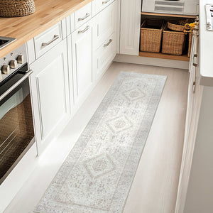 Compact kitchen with white cabinetry and wood countertops, featuring the Vernal Senglea Beige, Taupe & Cream Machine Washable Runner, adding a soft and stylish touch to the narrow floor space.
