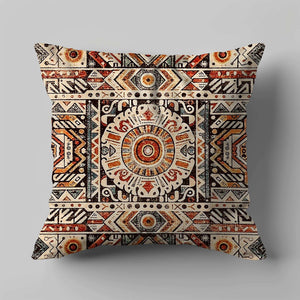 Green Decore Vernal Shea Indoor Cushion in beige, brown, and rust red, featuring an intricate tribal mandala pattern. This stylish decorative cushion adds warmth and earthy tones to sofas or chairs. Ideal for modern boho or ethnic-inspired home décor.